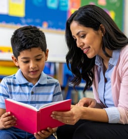 Teacher and student reading stock photo